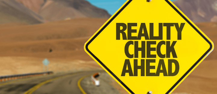 Road sign "Reality Check Ahead"