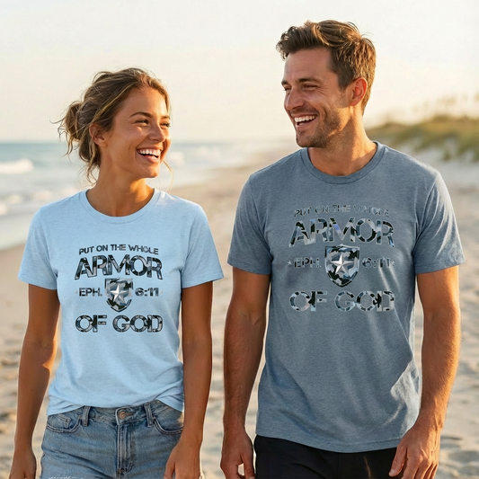 Two people on a beach wearing 'Armor of God' t-shirts.
